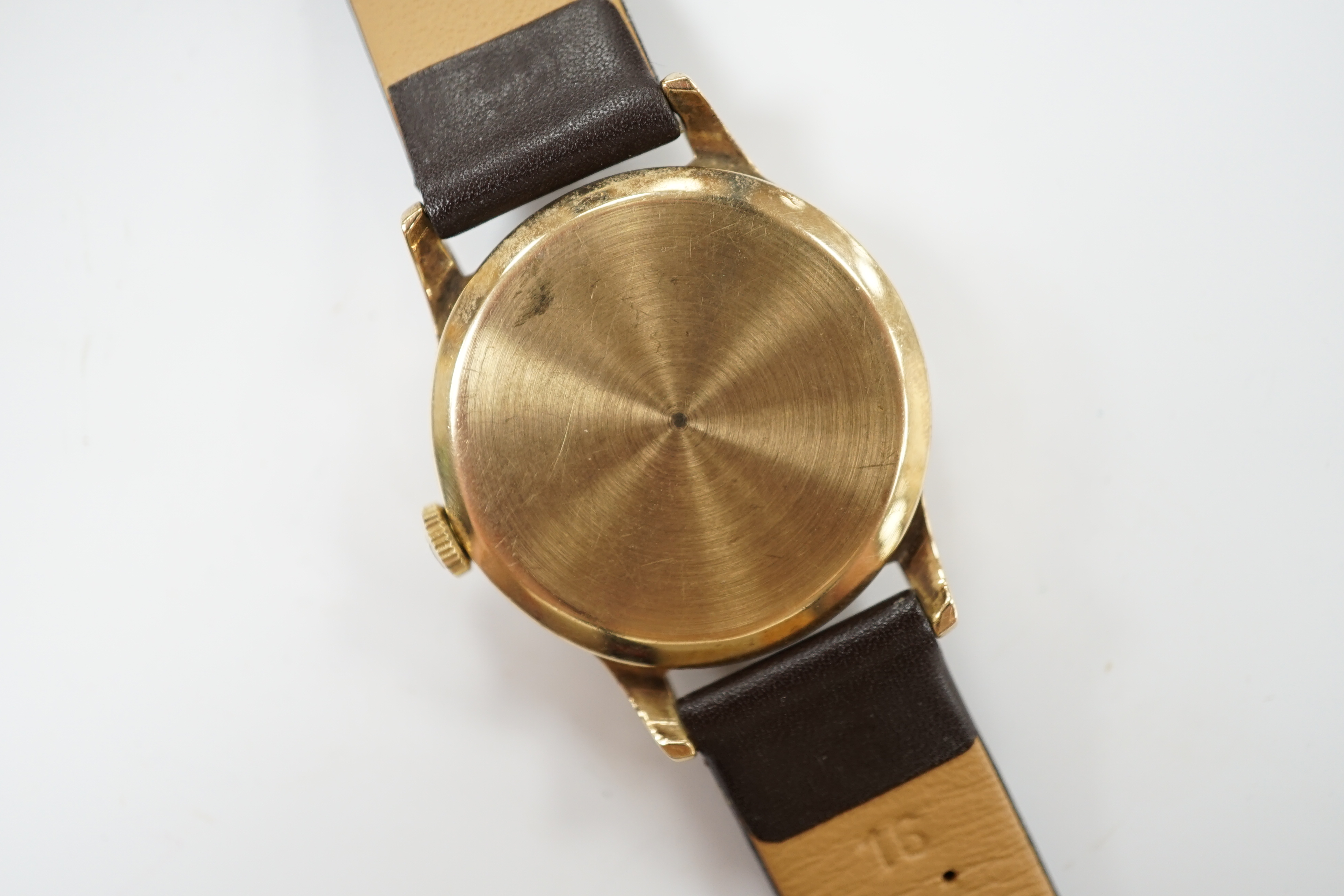 A gentleman's 9ct gold Tudor manual wind wrist watch, with Arabic dial and subsidiary seconds, on later associated strap, case diameter 31mm.